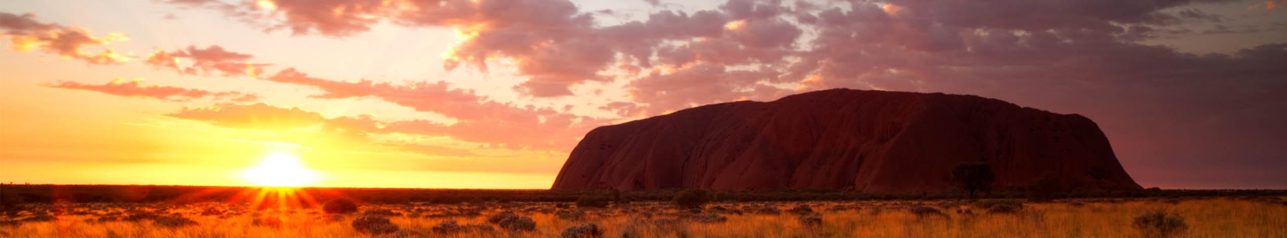 Solnedgang over Uluru og Kata Tjuta